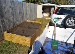 Backyard Garden Box Loaded with Soil and Ready for Planting