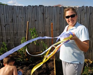 Sarah Supplies Pretty Ribbon to Tie Up the Plants - Pretty Plants = Happy Plants