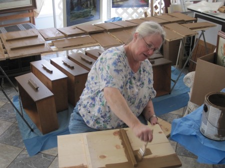 Marty painting parts of beds