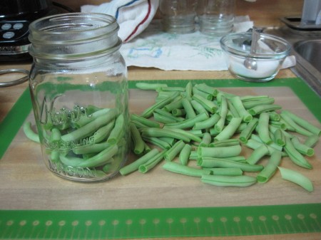 put cut beans into jars